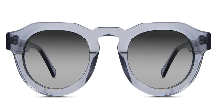 Jax black tinted Gradient sunglasses in periwinkle variant - is a narrow transparent frame with high keyhole shaped nose bridge and the crystal temple arms has visible silver wire core 